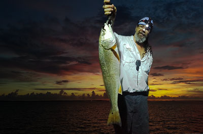 man with fish on hand 